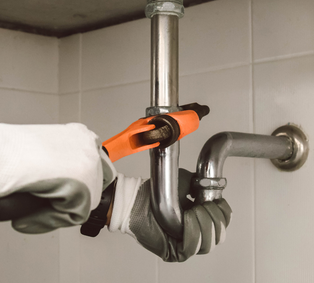 plumber at work in a bathroom, plumbing repair service , fix wat hot water